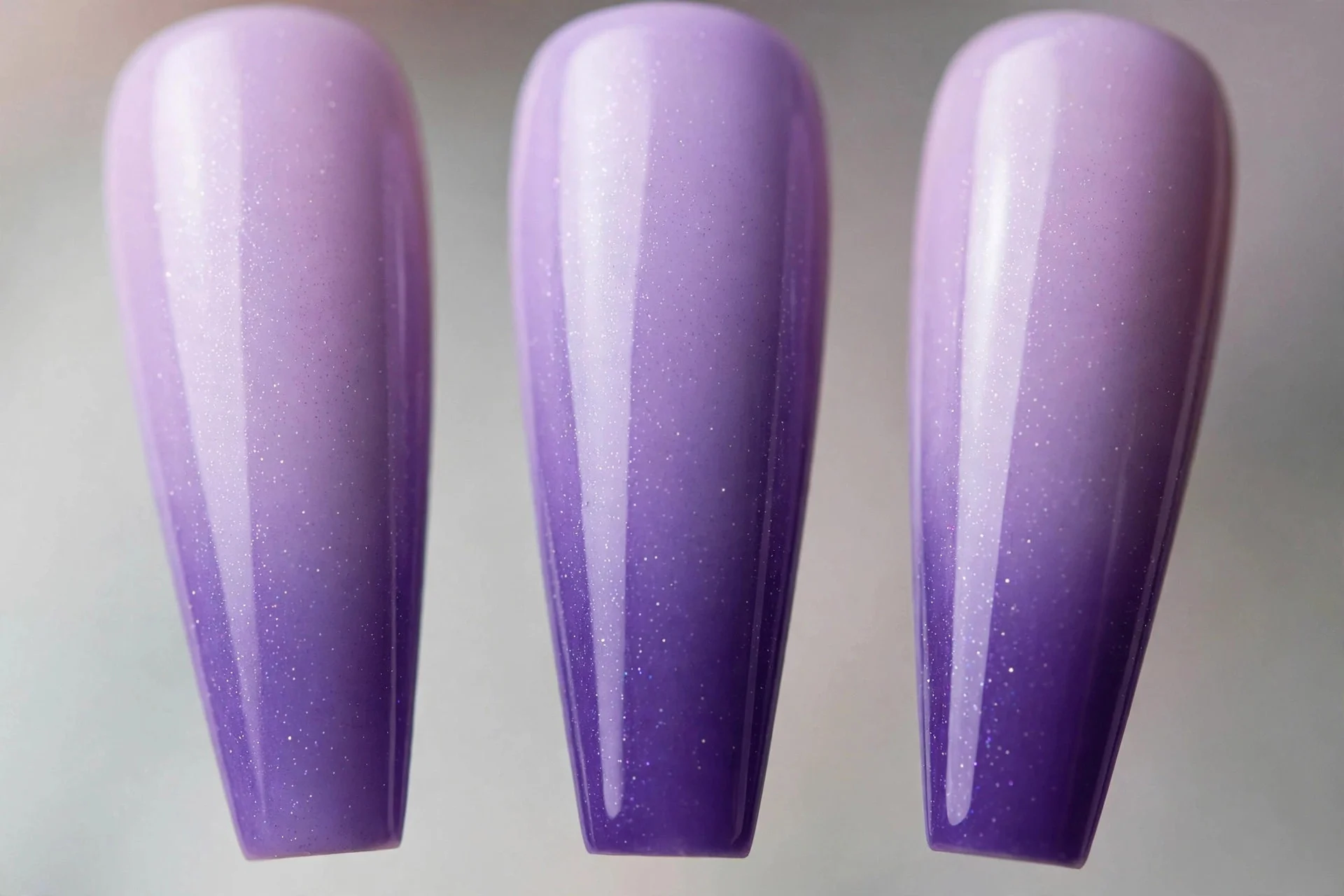 Lilac to violet ombré gradient nails, long coffin nails
