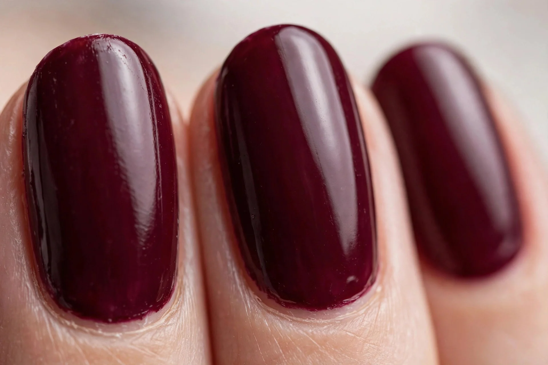 Deep burgundy wine polish, oval nails