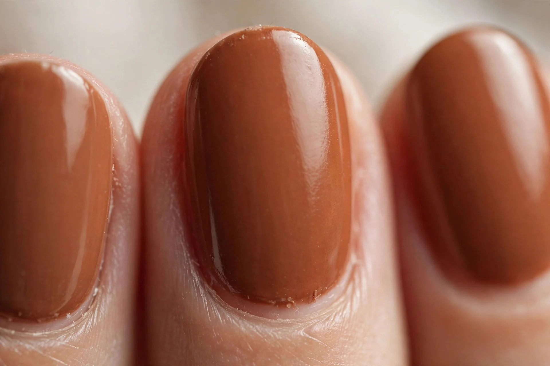 Warm cinnamon brown polish, oval nails