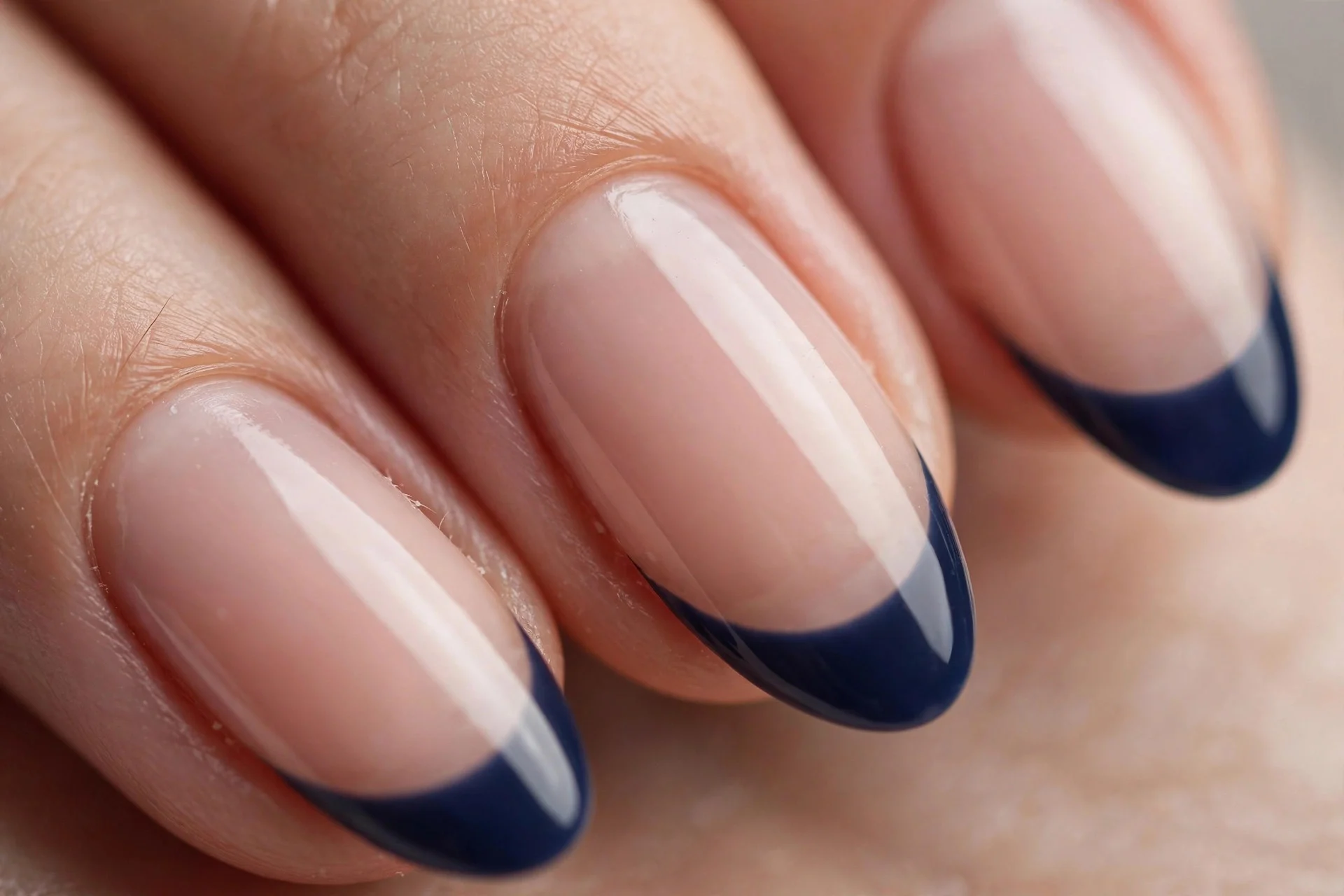 Navy French tips on sheer nude, almond