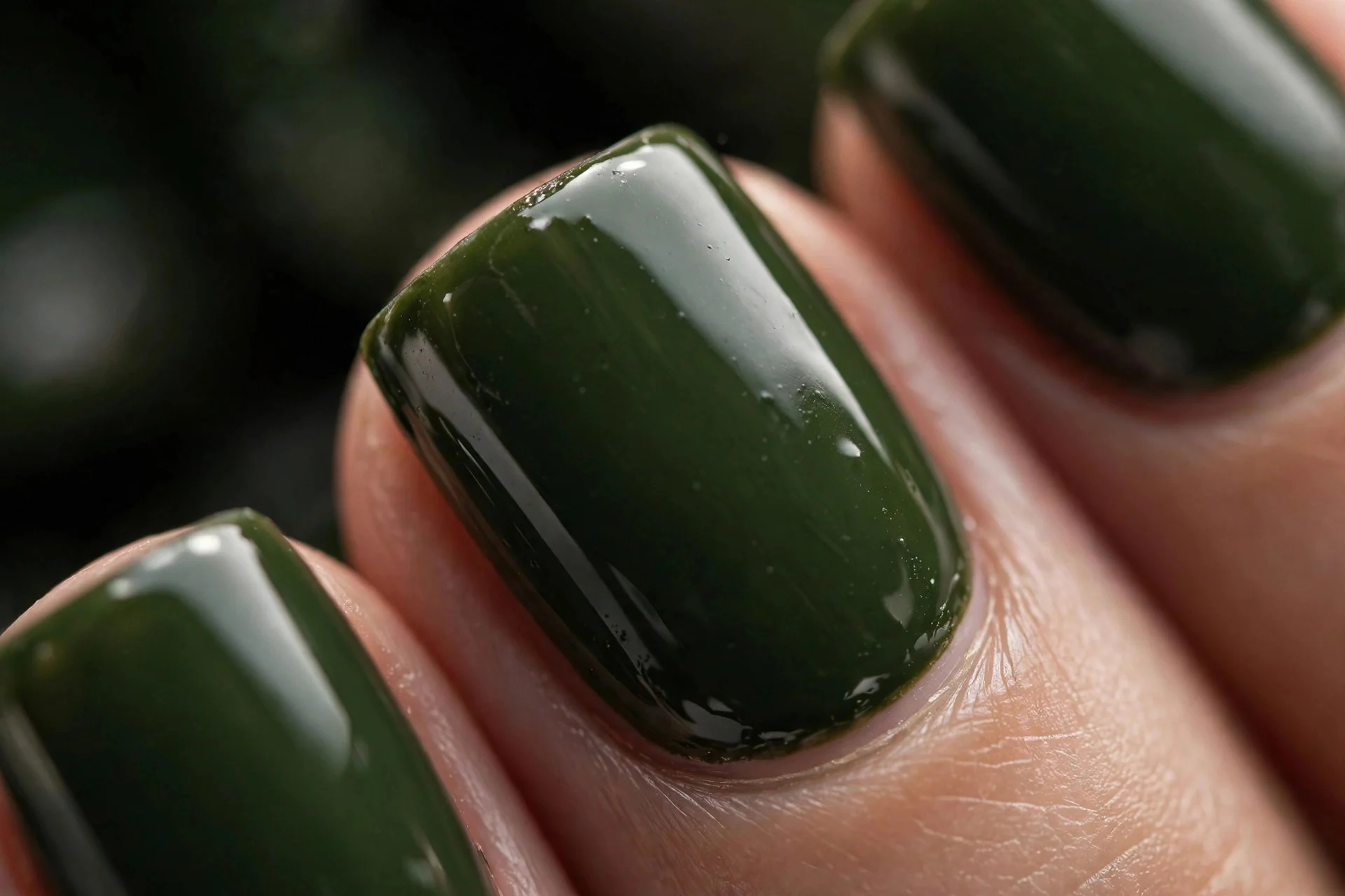 Square nails in deep dark matcha green crème, glossy, dark background