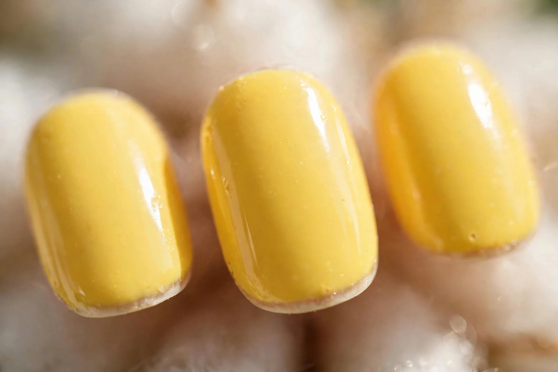 Butter yellow polish, short oval nails