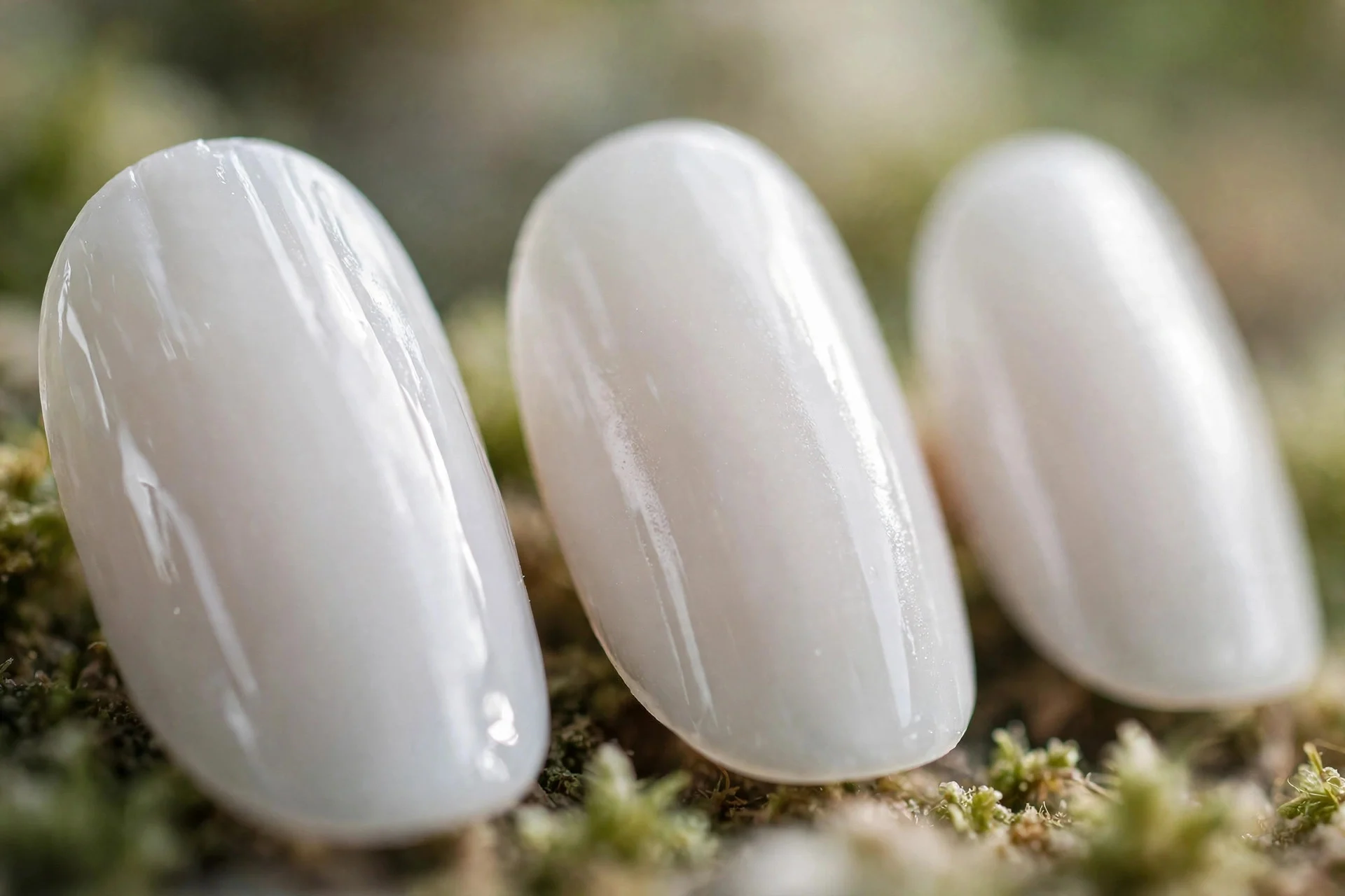 milky white press-on nails in short almond shape, glossy
