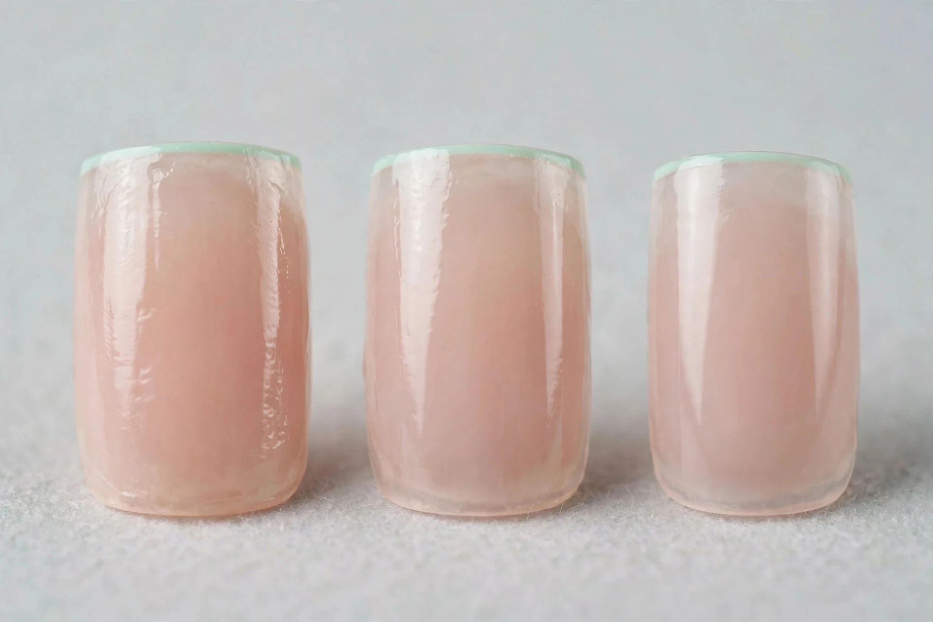 Sheer nude nails with thin mint micro French tips, square