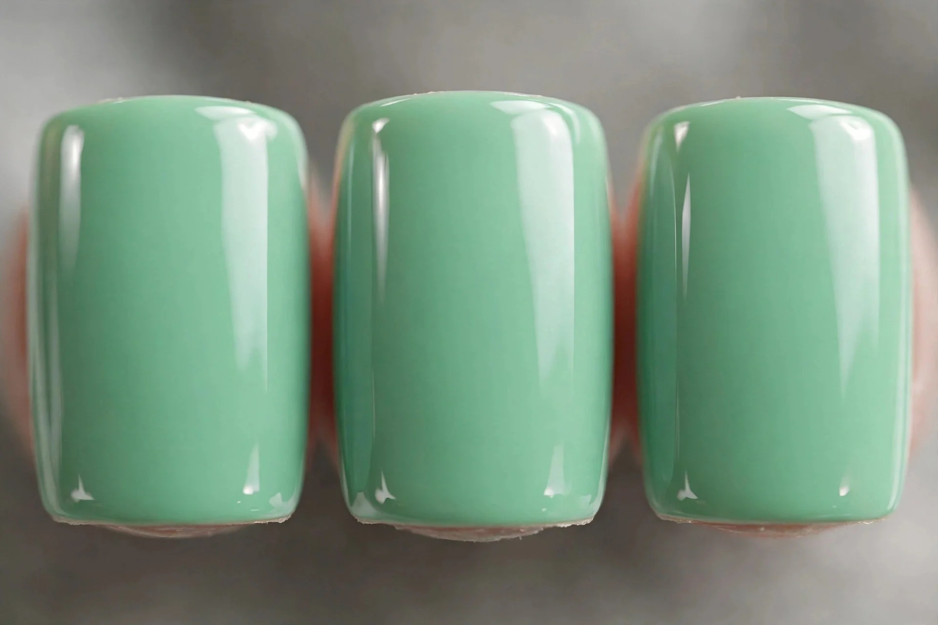 Short mint green nails with mirror gloss finish, square
