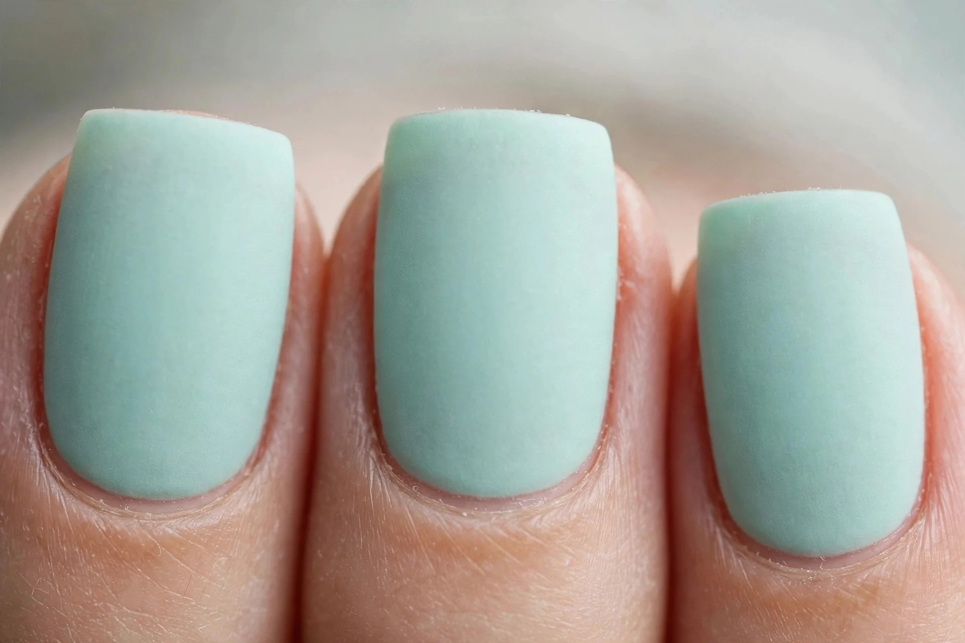 Mint polish with matte finish, medium square nails