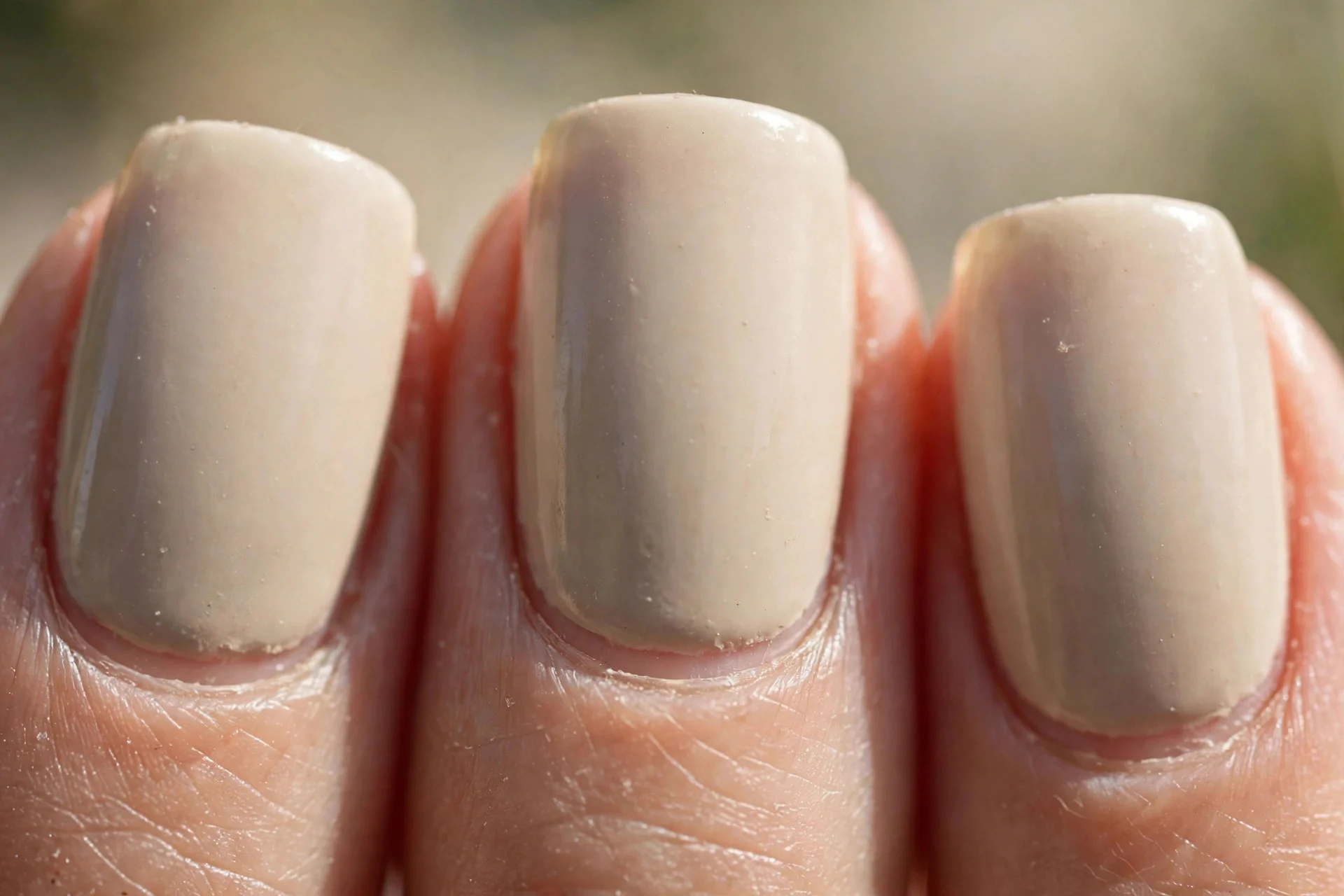 squoval nails in warm creamy greige polish