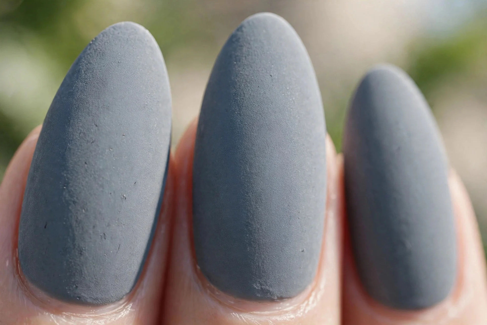 matte slate grey almond nails with a velvety finish
