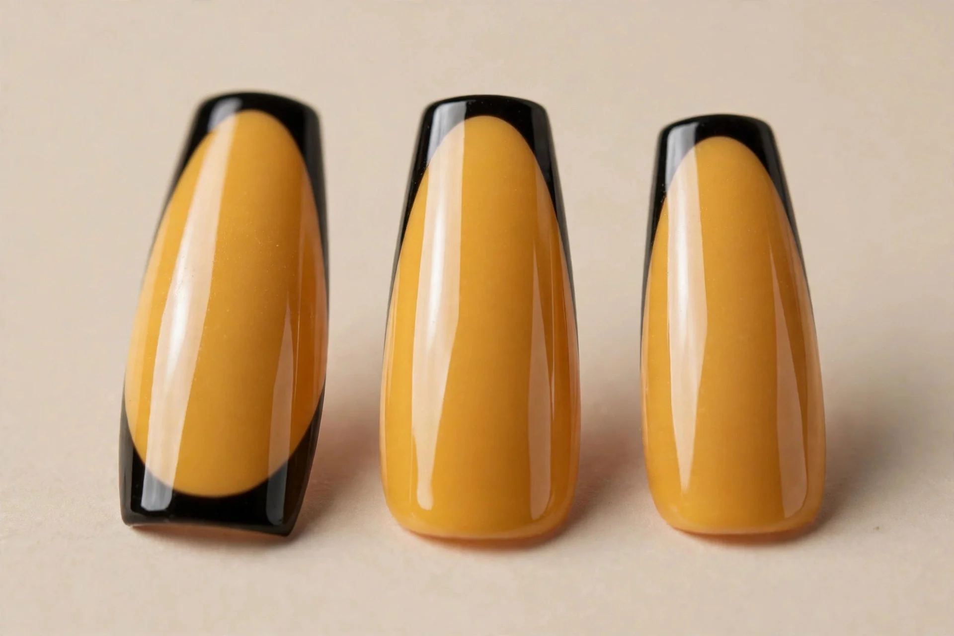 mustard yellow base with crisp black French tips, long coffin nails, glossy finish