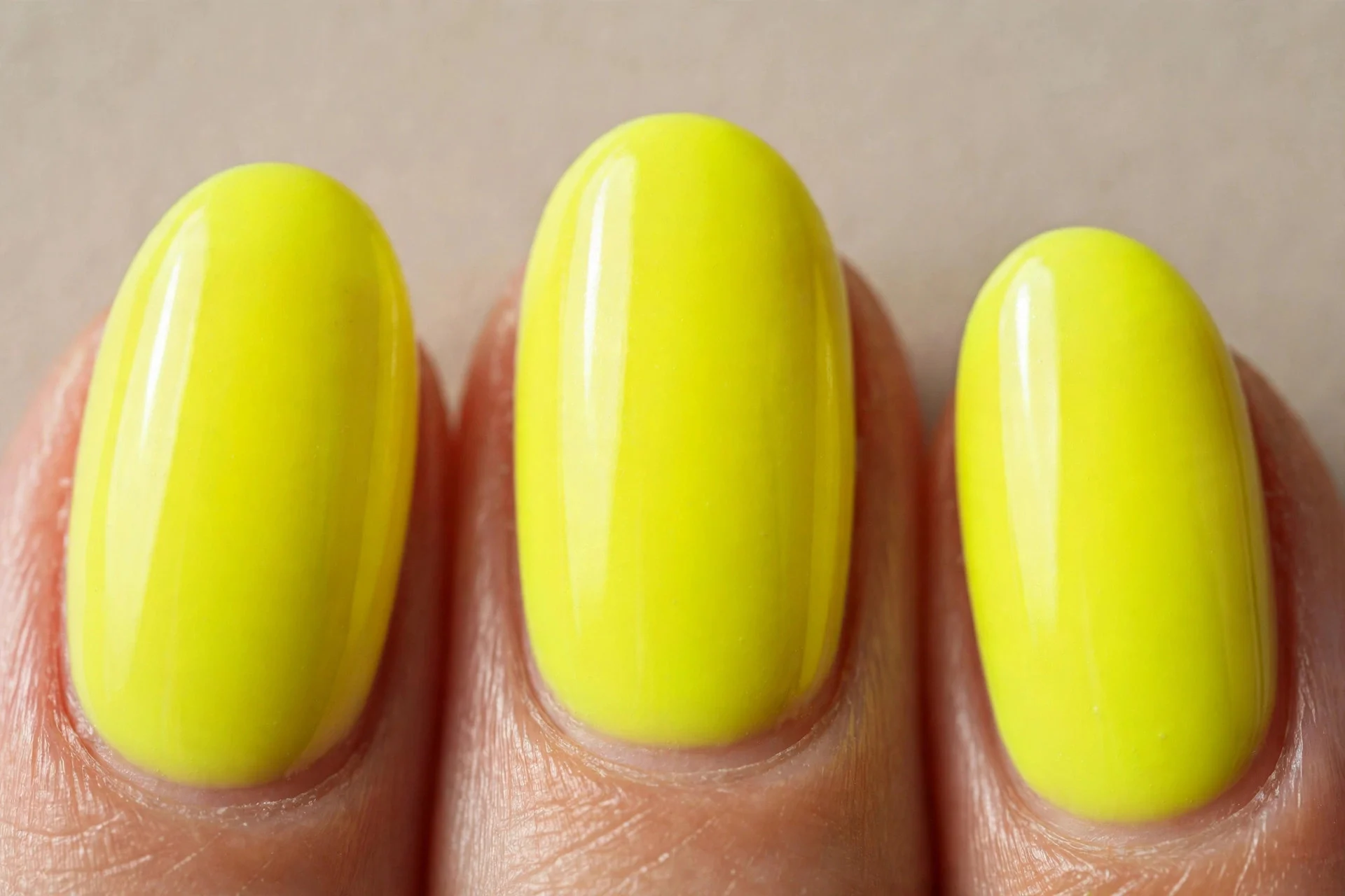 neon yellow over white base, oval nails, vivid