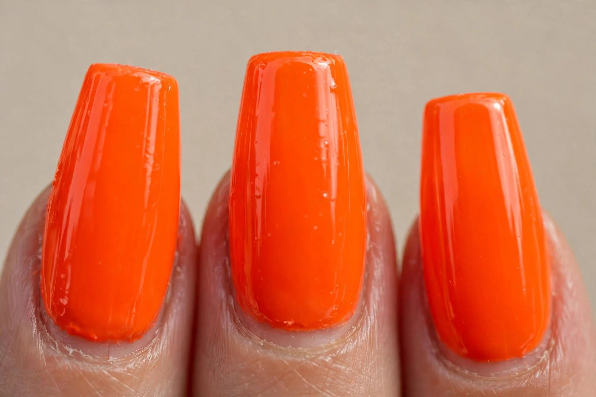 vivid neon orange gel, coffin nails, high-gloss
