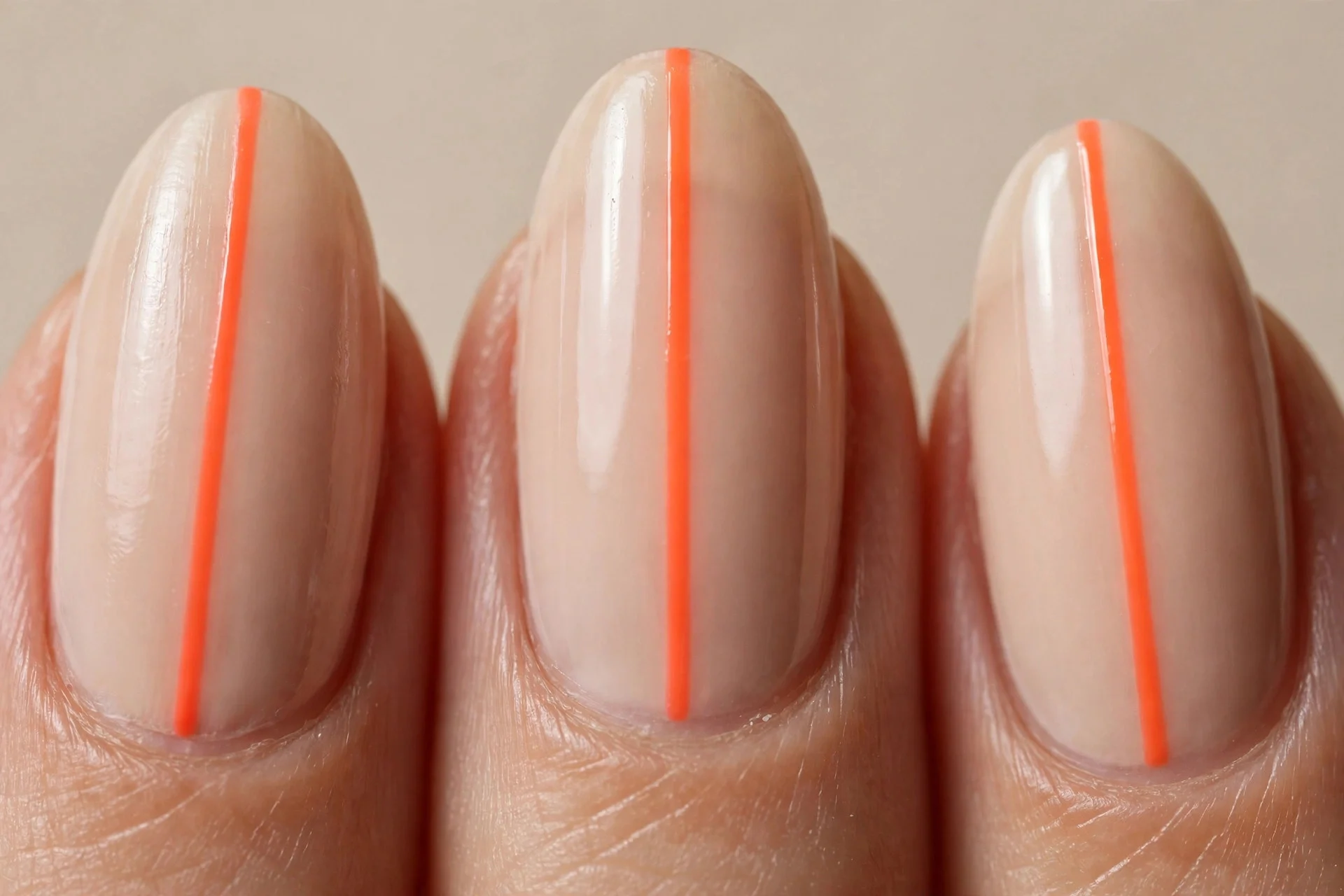 neon orange vertical stripe, nude almond nails