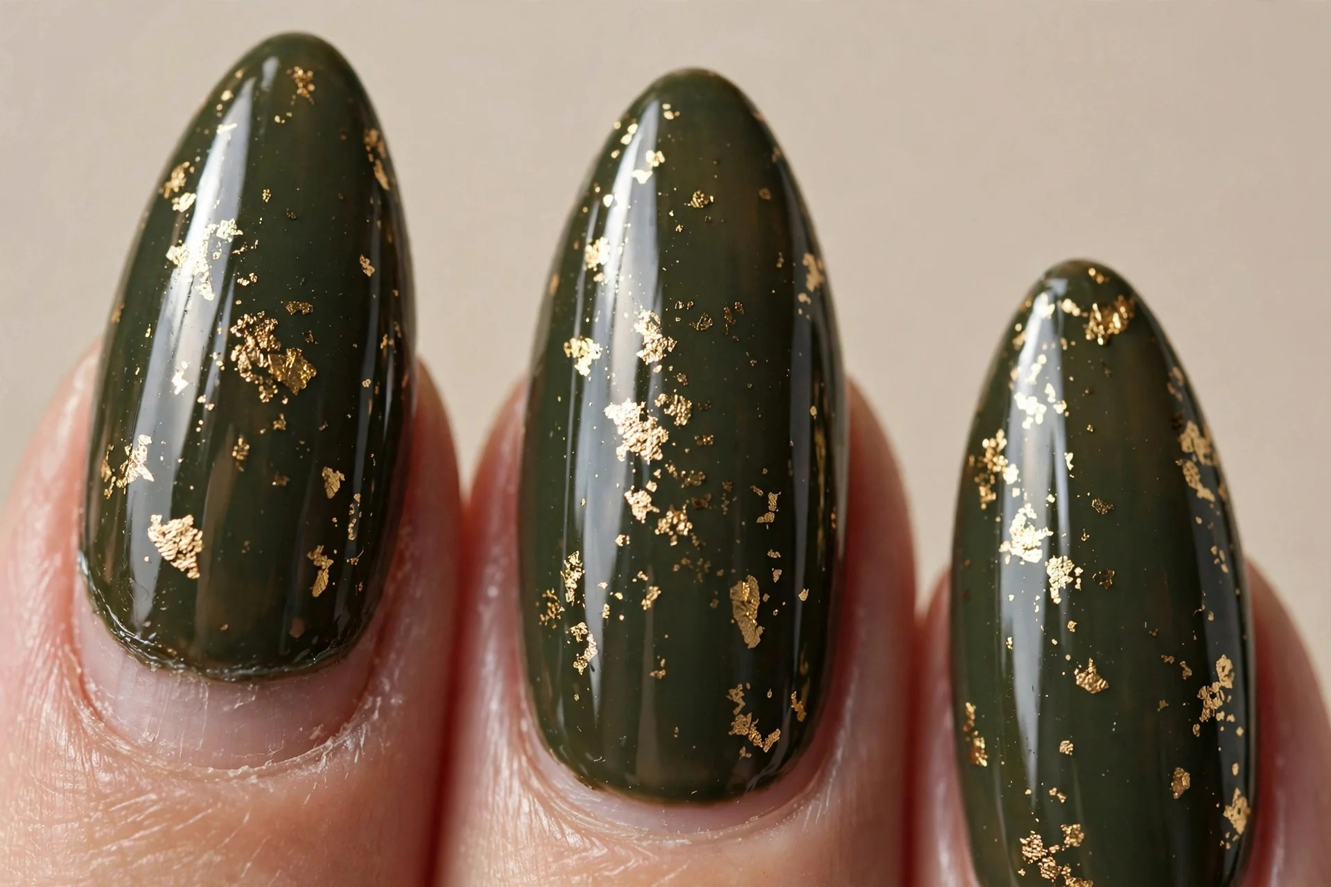dark olive gloss, gold-leaf flakes, almond