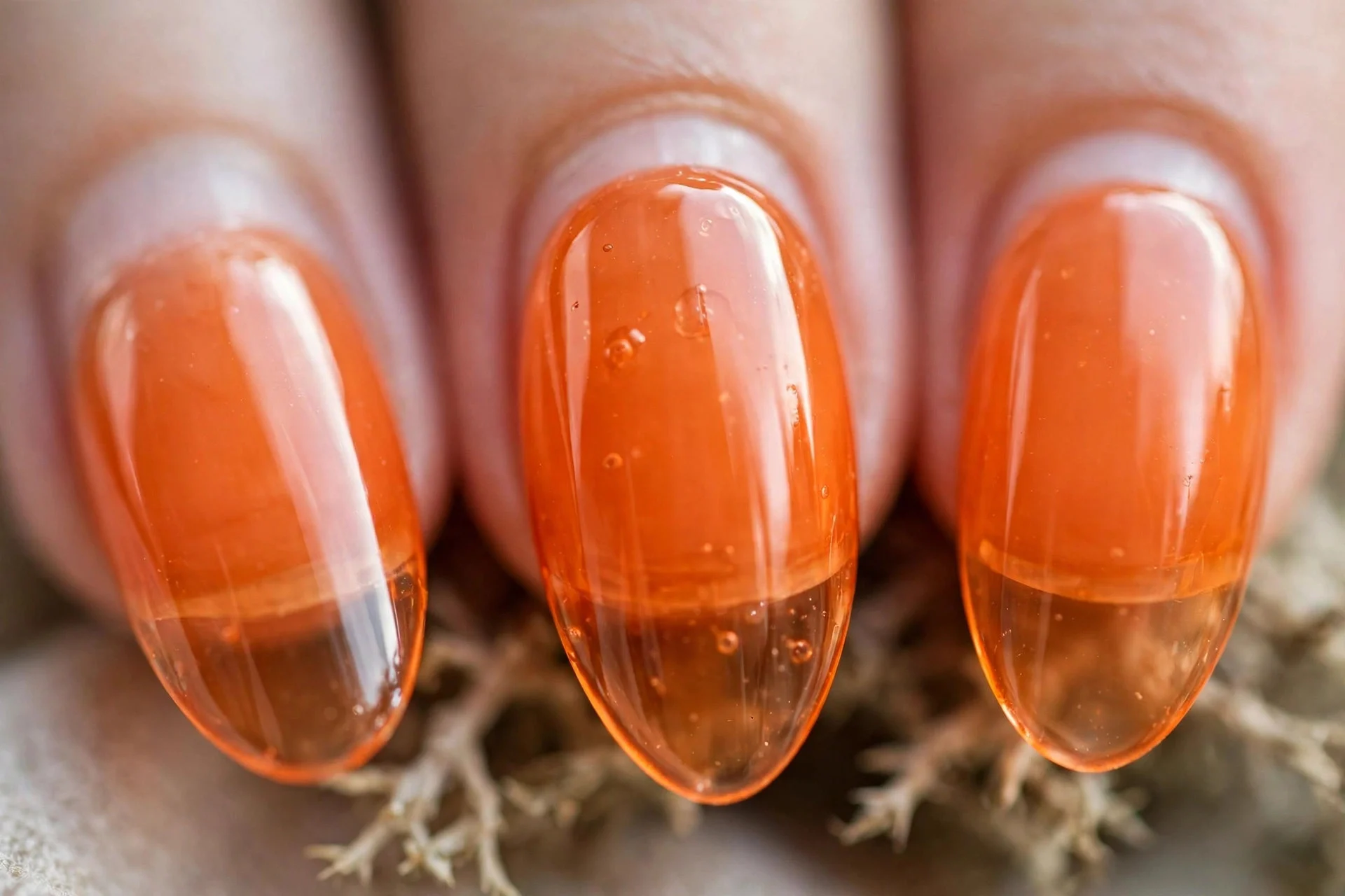 Translucent orange jelly nails, medium almond, glossy