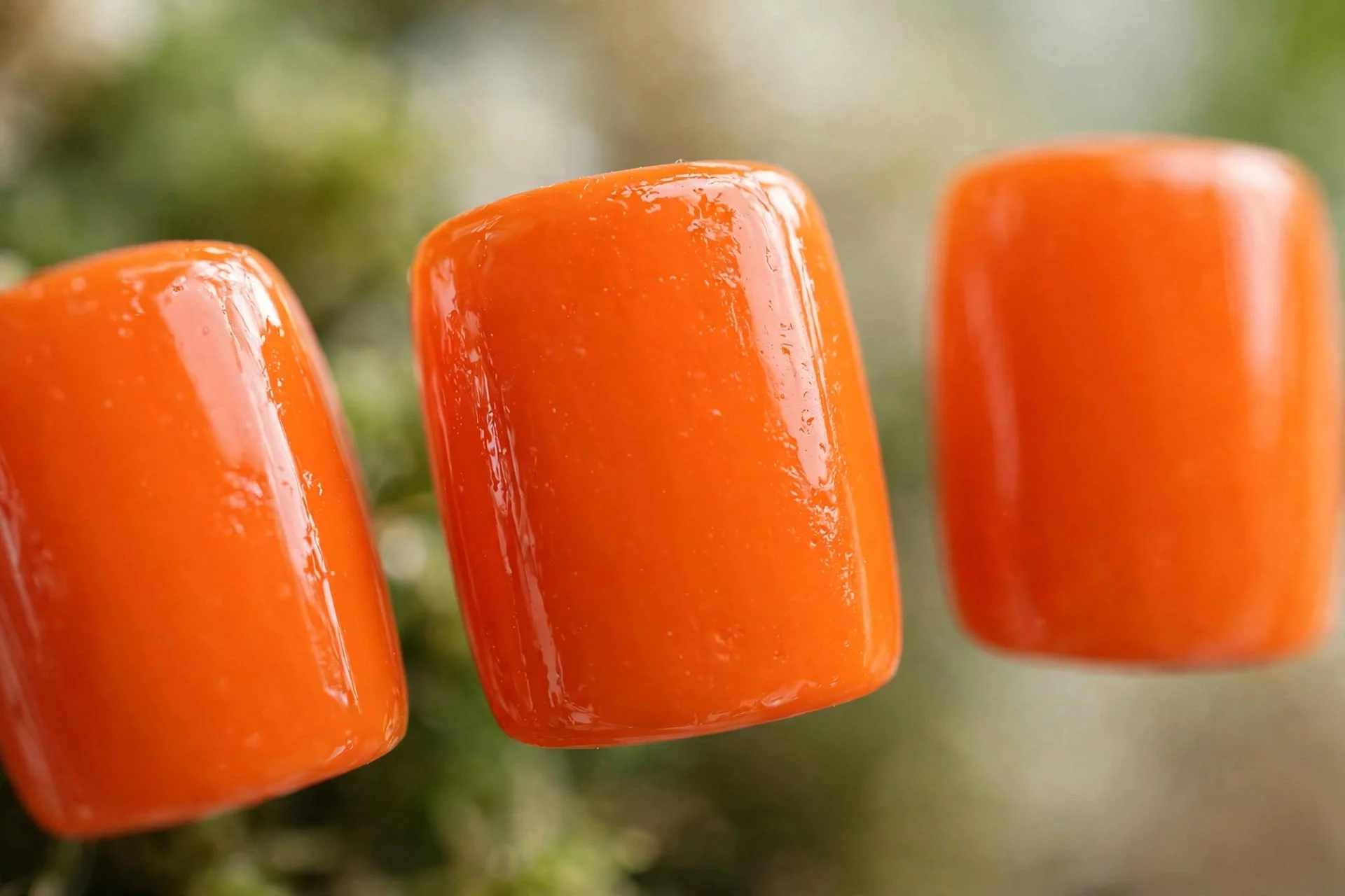 Bright true tangerine polish, medium square nails, high gloss