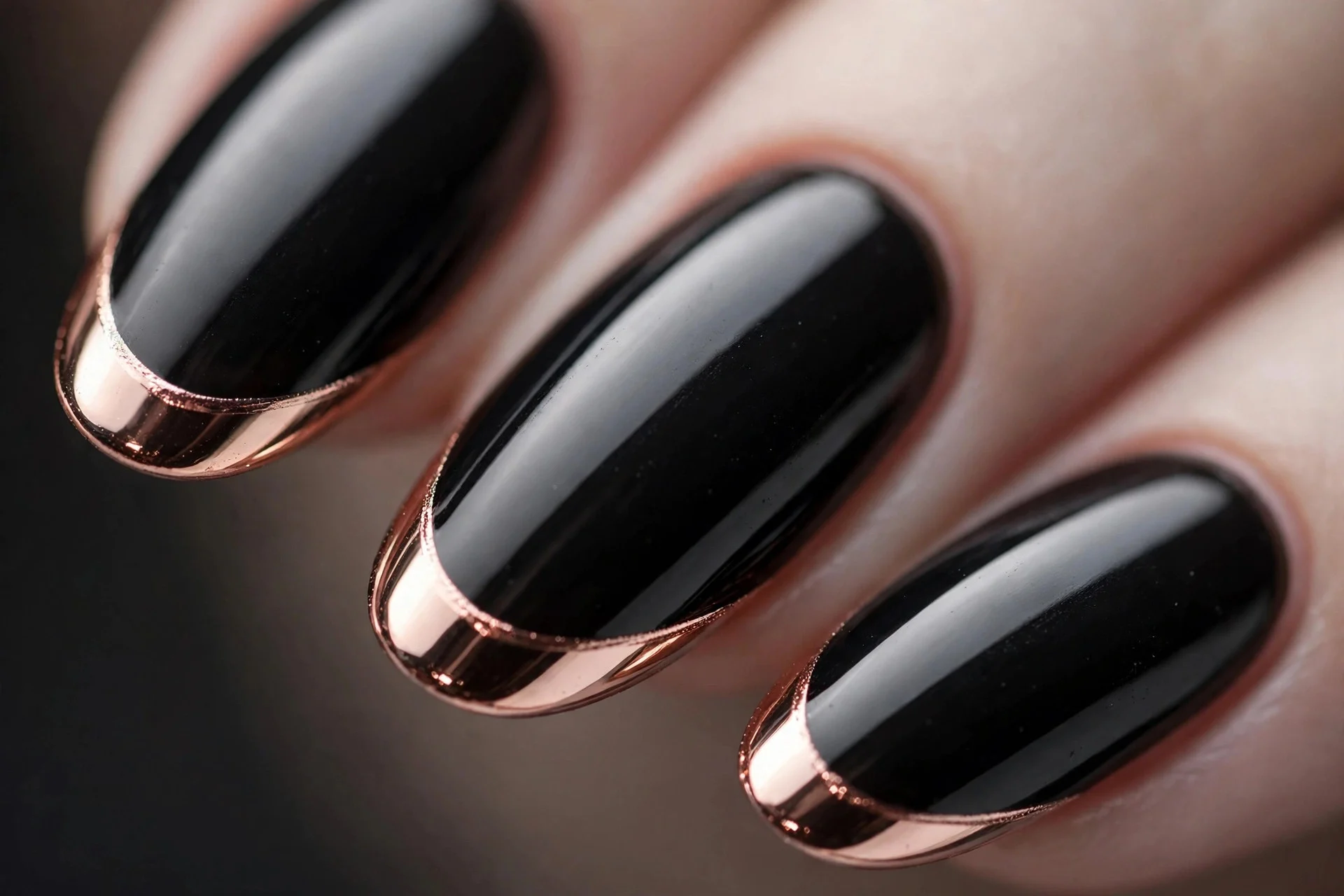 Glossy black nails with rose gold chrome French tips, almond nails