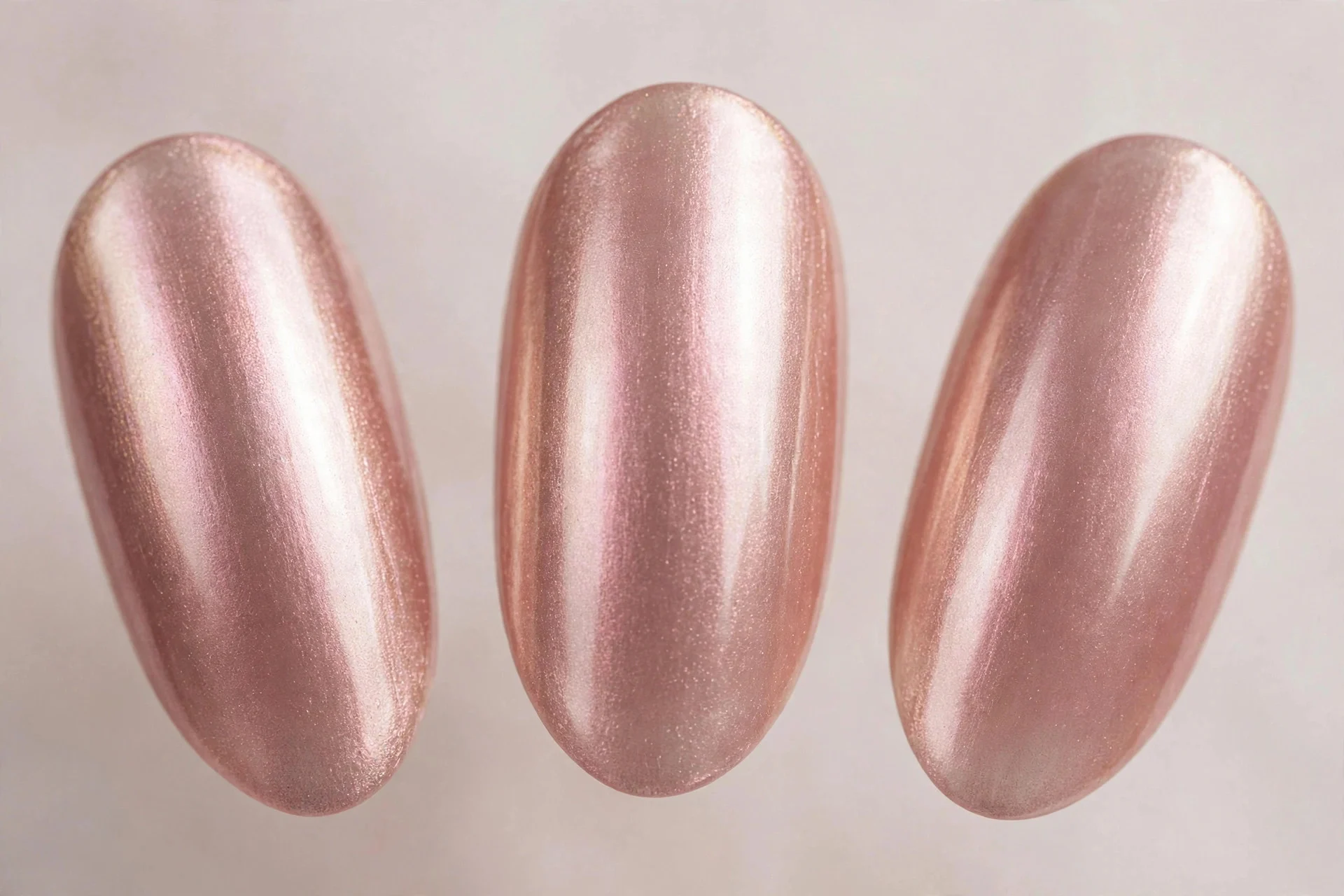 Rose-champagne chrome nails, medium almond, soft pink metallic