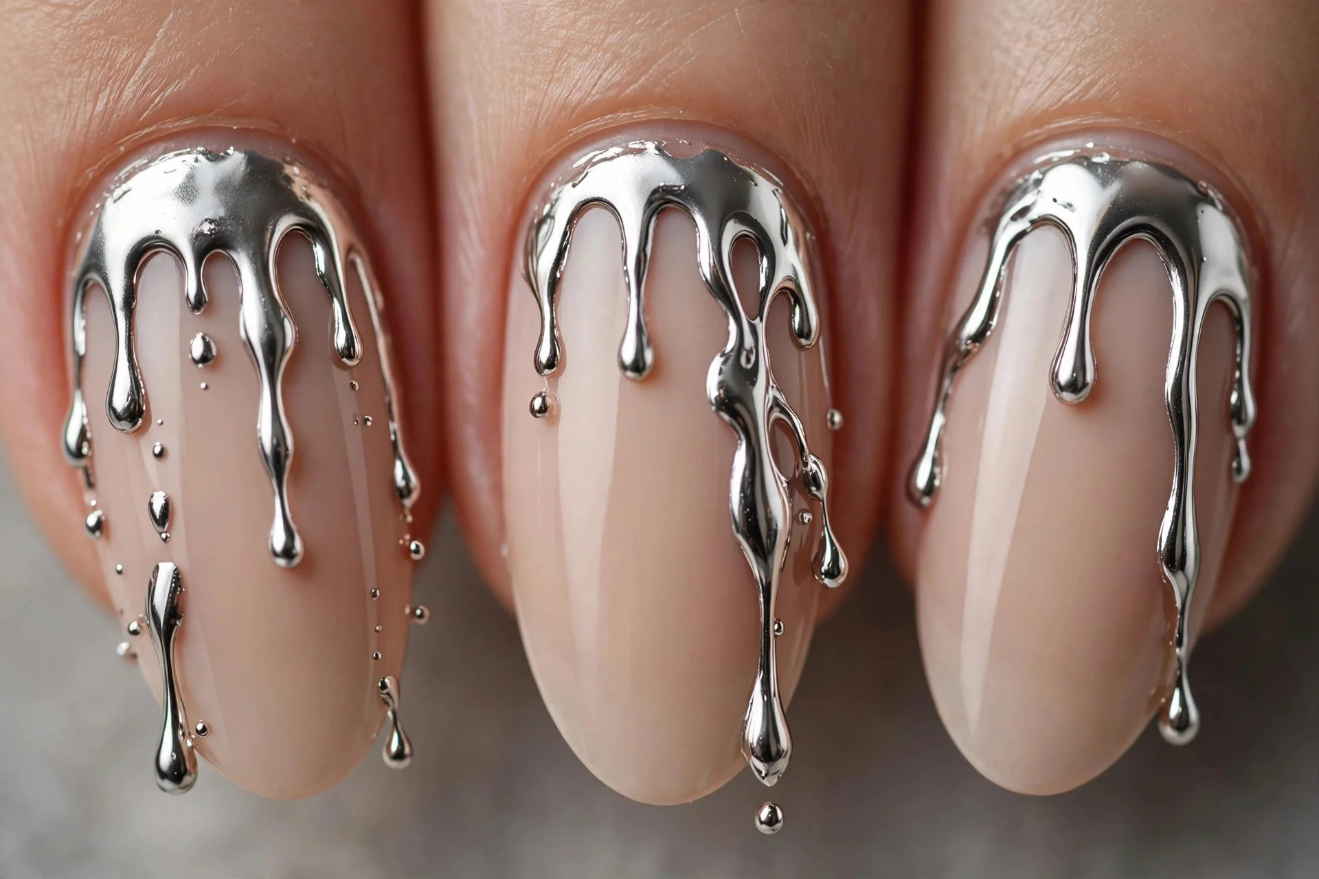 Nude nails with molten silver drip art from cuticle, medium almond