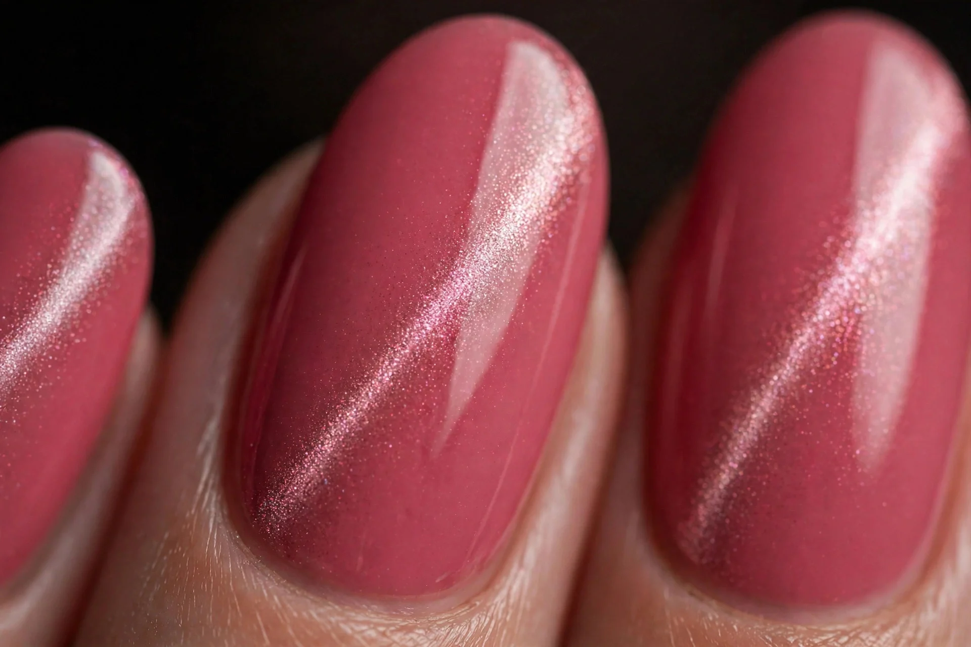 Almond nails with deep strawberry milk cat eye, magnetic shimmer diagonal stripe, dark background