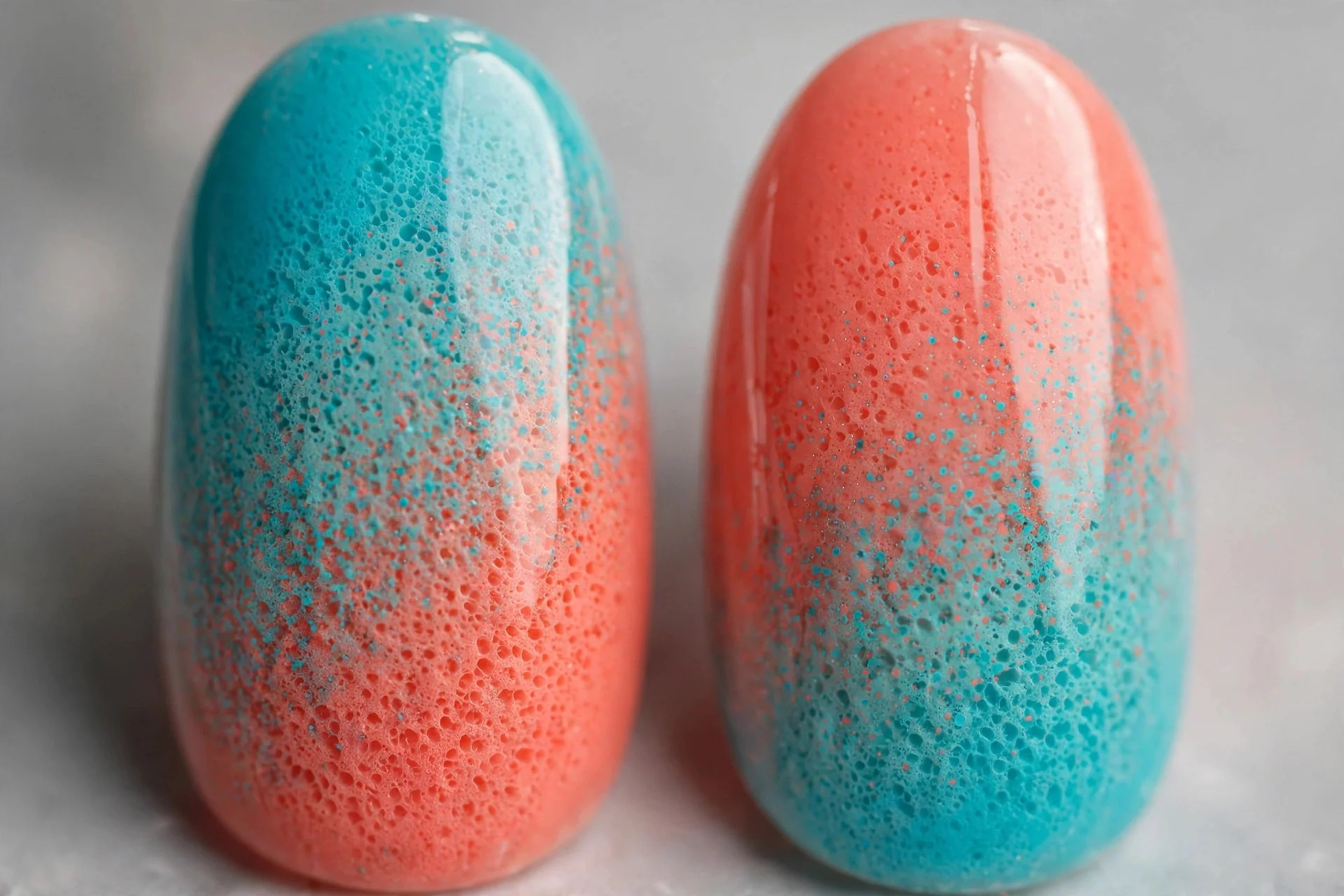 Turquoise to coral sponged gradient nails, medium almond, glossy