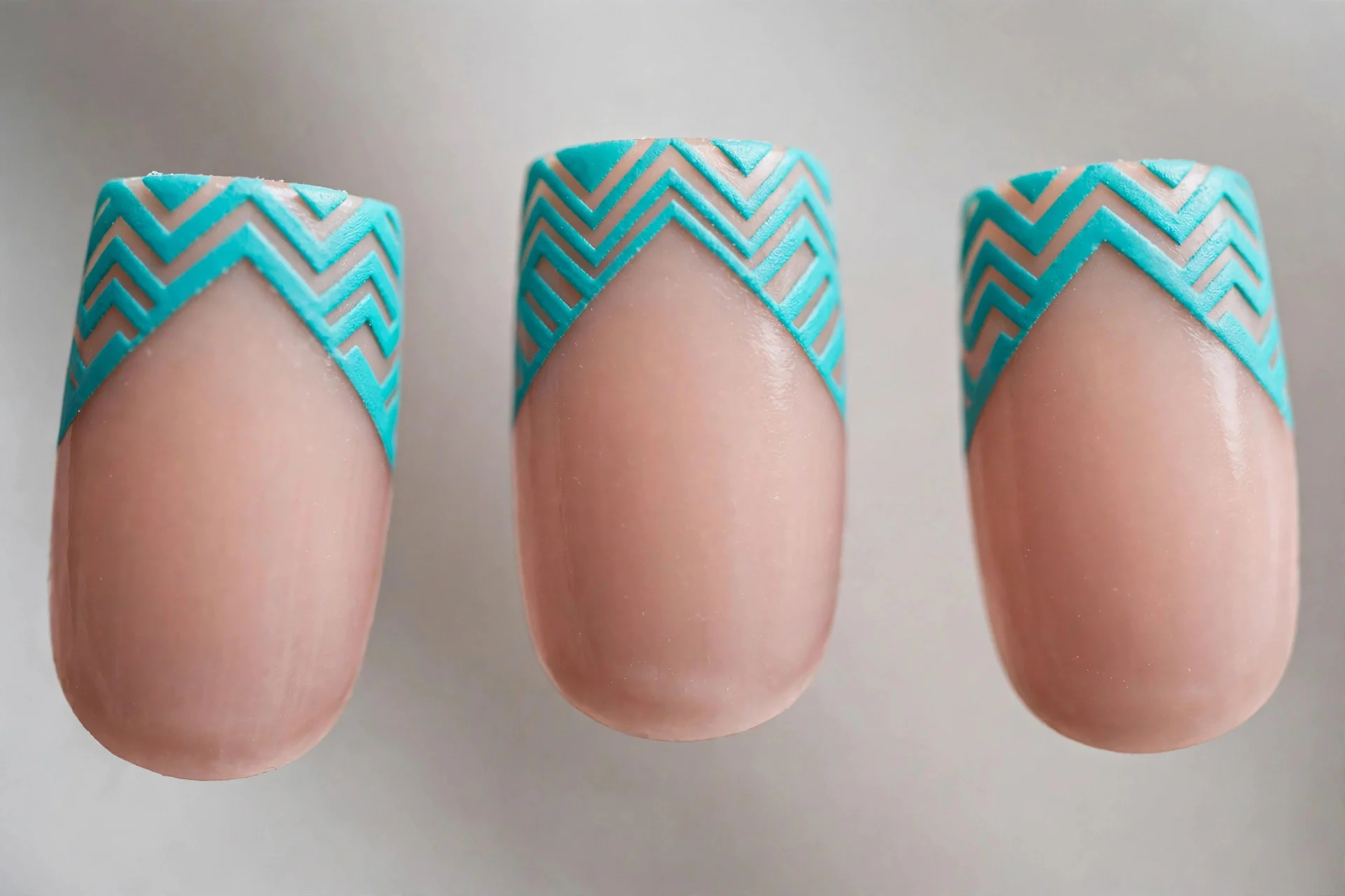 Nude nails with turquoise chevron zigzag tips, square