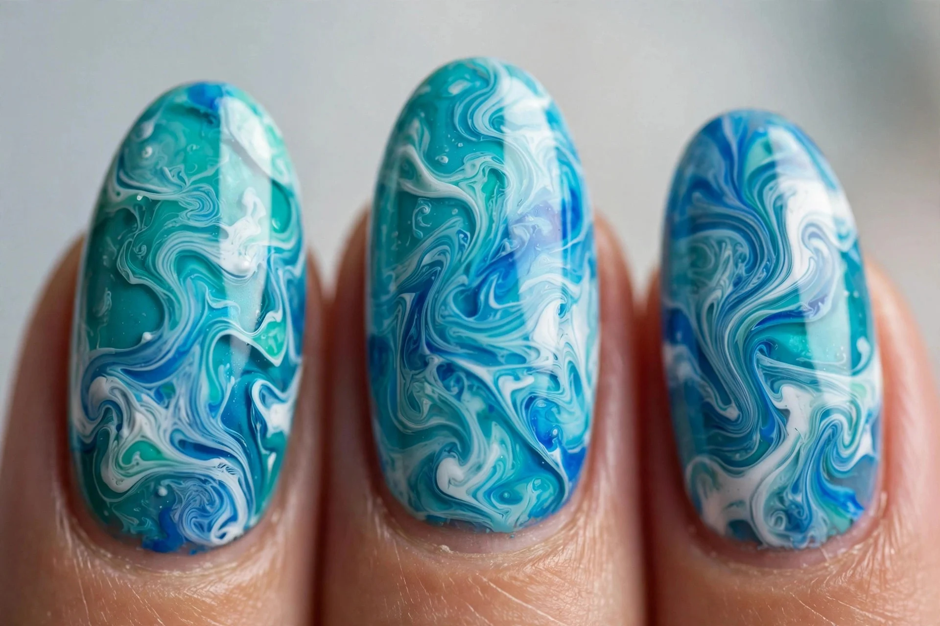 Turquoise white and blue water marble nails, medium almond