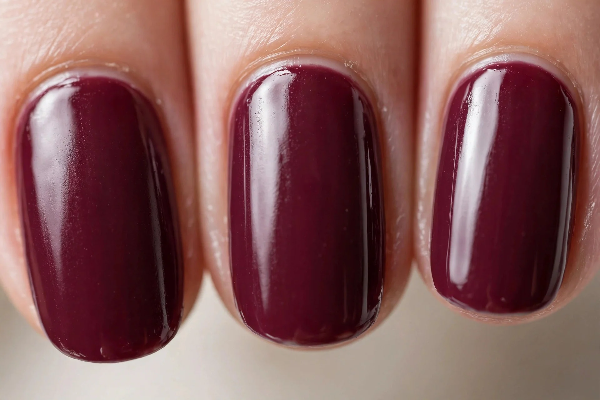 Creamy opaque bordeaux wine polish, short oval nails, glossy
