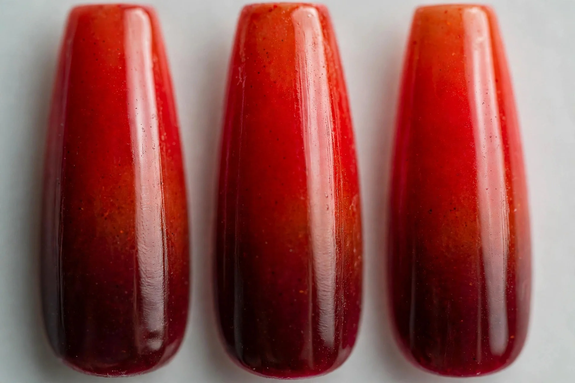 Wine to bright spiced red ombré gradient, long coffin nails
